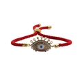 Adjustable red woven cord bracelet featuring a gold Evil Eye charm with colorful crystals - Red Rope