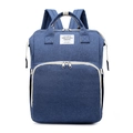 Front detail of blue polyester diaper bag showing textured fabric and zipper compartments - Dark Blue
