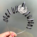 Macro detail of black crystal crown with silver crescent moon and pearl accents - Crown Hairband / Black