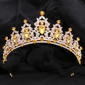 Detailed view of gold leaf crown with yellow gemstones and rhinestones on black velvet - KC Gold White Diamond + Light Coffee Diamond