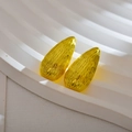 Macro detail of gold irregular water drop earrings with textured vertical ridges on stone - Teardrop / Gold