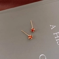 Elegant gold earrings with orange zircon stones set on a minimalist fashion book cover - Simple Orange Red Zircon Studs
