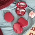 Deep red heart-shaped contact lens case set with mirror and tools on soft fabrics - Red