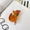 Detailed view of caramel acrylic puppy hair claw with a mini Christmas hat and green collar - Knit Hat Yellow Dog