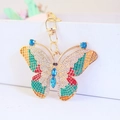 Portachiavi a farfalla dorato con strass colorati e chiusura a moschettone da donna - Blu
