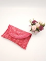Handmade magenta corn husk woven clutch bag with a textured flap closure design - Pink