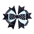 Dettaglio del fermaglio a fiocco multistrato con pois neri e tessuto bianco glitterato - Nero