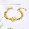 Bracciale a catena dorata con ciondolo a quadrifoglio in cristallo trasparente elegante - Quadrifoglio e Farfalla