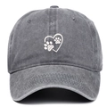 Detailed view of white heart and paw embroidery on a washed dark gray cotton baseball cap - Adjustable / Gray