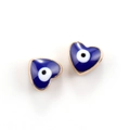 Macro shot of two heart-shaped evil eye pendants in blue enamel and gold finish - 10pcs Dark Blue Evil Eye Heart Beads