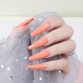 Detailed view of long orange coffin ballet false nails with a glossy UV top coat finish - Orange (CBLL-31)