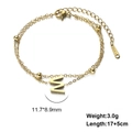 Detail of double-layer gold stainless steel bracelet with letter M pendant and small beads - Letter-W / Gold