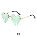 Y2K melting heart sunglasses with mint green lenses and gold metal frame style - Light Green
