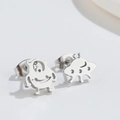 Asymmetric punk silver monster studs featuring cartoon alien figures on white backdrop - One-Eyed Monster / Steel