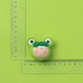 Handmade crochet green frog pendant charm with measurement ruler showing 5cm width - MENGSI Frog Dumpling Doll