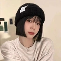 Winter plush knitted hat in black, featuring a soft texture and casual fleece finish - Cable Black