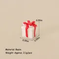 Miniature white Christmas gift box ornament with a red resin bow and glossy finish - No.44 - Resin Mini Gift Box - White