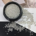 Elegant silver metallic micro beads for nail art in a black circular storage box - Silver Steel Ball 1.0mm