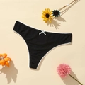 Detail of black ribbed thong featuring white lace trim and a delicate bow detail - Black