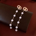Detail view of long tassel earrings with gold-tone pig nose motif and gradient pearls - Pig Nose (Chaine d'Ancre) Style Diamond Pearl Tassel (30#)