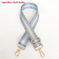 Detail of adjustable light blue nylon strap with silver stripes and gold metal swivel hooks - Light Blue + Gold Hook
