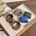 Five elastic fabric hair ties in brown, red, green, and blue on a wooden tray - 1# Korean Style Color System