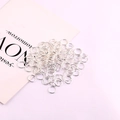 Bulk silver jump rings on decorative paper for handmade jewelry making and DIY projects - 4mm (Approx 400pcs/20g) / Silver