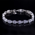 Silver geometric bracelet featuring alternating square and round AAA zircon stones - White