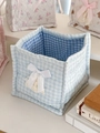 Close-up of blue quilted heart storage basket with white satin bow and lace detail - Lace Sweetheart Square Storage (Blue Grid)