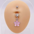 Detailed view of pink cherry blossom navel ring with crystals on a skin model - Pink Cherry Blossom