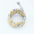 Snake-shaped coil bracelet in silver and gold tone with black gemstone eyes - Three Colors