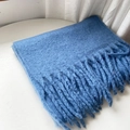 Blue mohair scarf with soft knit texture and fringe tassels on white background - Fog Blue