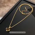 Collier chaîne torsadée plaqué or 18K avec pendentif œil de tigre et fermoir mousqueton - 75# Collier Pierre Griffée Corde Torsadée Doré Café
