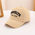 Close-up of black Brooklyn New York embroidery on a beige cotton baseball cap - 54cm (3-8 Years) / Khaki