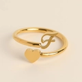 Adjustable golden ring featuring a polished heart and cursive letter F detail - Letter F