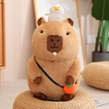Brown capybara plush toy with white bird on head and orange crossbody bag on a woven mat - Sitting Squeaking + Bubble Spitting / 20cm