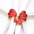 Sparkling red enamel bow napkin ring with gold edges on a white linen napkin - 122-Red Glitter Bow