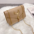 Vintage beige crossbody bag with gold elk head buckle and chain strap on white plush - Apricot