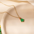 Golden necklace with green Christmas tree pendant and red enamel bow details - Bow Christmas Tree Necklace