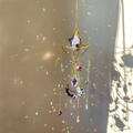 Detail of crystal sun catcher with blue stone casting colorful rainbows on wall - 49-51cm / Gold Alloy + Lapis Lazuli