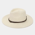 Close-up of cream woven straw fedora featuring a brown leather band and vintage metal emblem - One Size / Beige