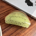 Close-up of kiwi fruit shaped hair claw clip made of translucent green resin on wood - Kiwi Style (9cm) (A7-3-3)