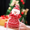 Knitted Christmas drawstring gift bag featuring a 3D snowman head and Nordic patterns - Knitted Snowman Pouch