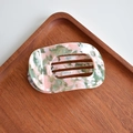 Macro detail of rectangular cutout acetate hair claw with pink and green marble texture - Round Claw / Pink Green Floral