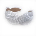 Macro detail of braided texture and shimmering metallic finish on white wide headband - White