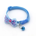 Adjustable light blue nylon pet collar with a pink polka dot bowknot and a blue bell - Cyan