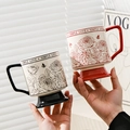 Detail of rose floral ceramic mugs with base and Simple Love text in lifestyle setting - Red & Black Couple Mugs + 2 Spoons