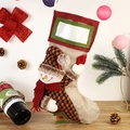 Christmas stocking with snowman doll and transparent photo pocket on festive background - Snowman
