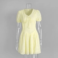 Close-up of yellow cotton dress featuring intricate floral embroidery and cut-out details - S / Yellow