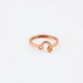 Macro shot of rose gold Leo zodiac sign open ring with smooth mirrored stainless steel finish - Adjustable Open Rose Gold / Leo